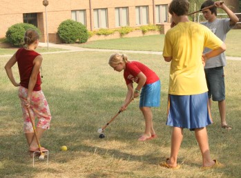 Kids playing croquet