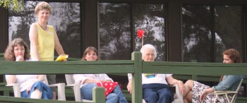 Women watching rock throwing contest