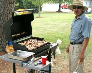Jorge grilling sausages